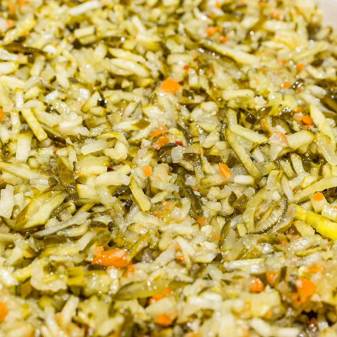 Close-up of chopped spicy dilly de gallo pickles mixed with carrots and spices in a relish style mixture